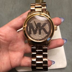 MK rose gold watch, used in good condition.
